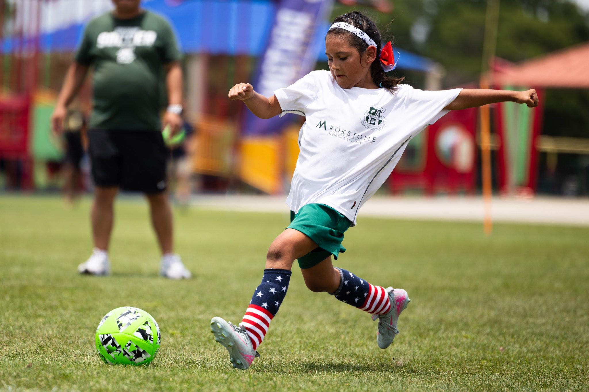 Young girl soccer player winds up to kick ball at Deltona Youth Soccer Club Recreation World Cup 2026 Deltona Florida
