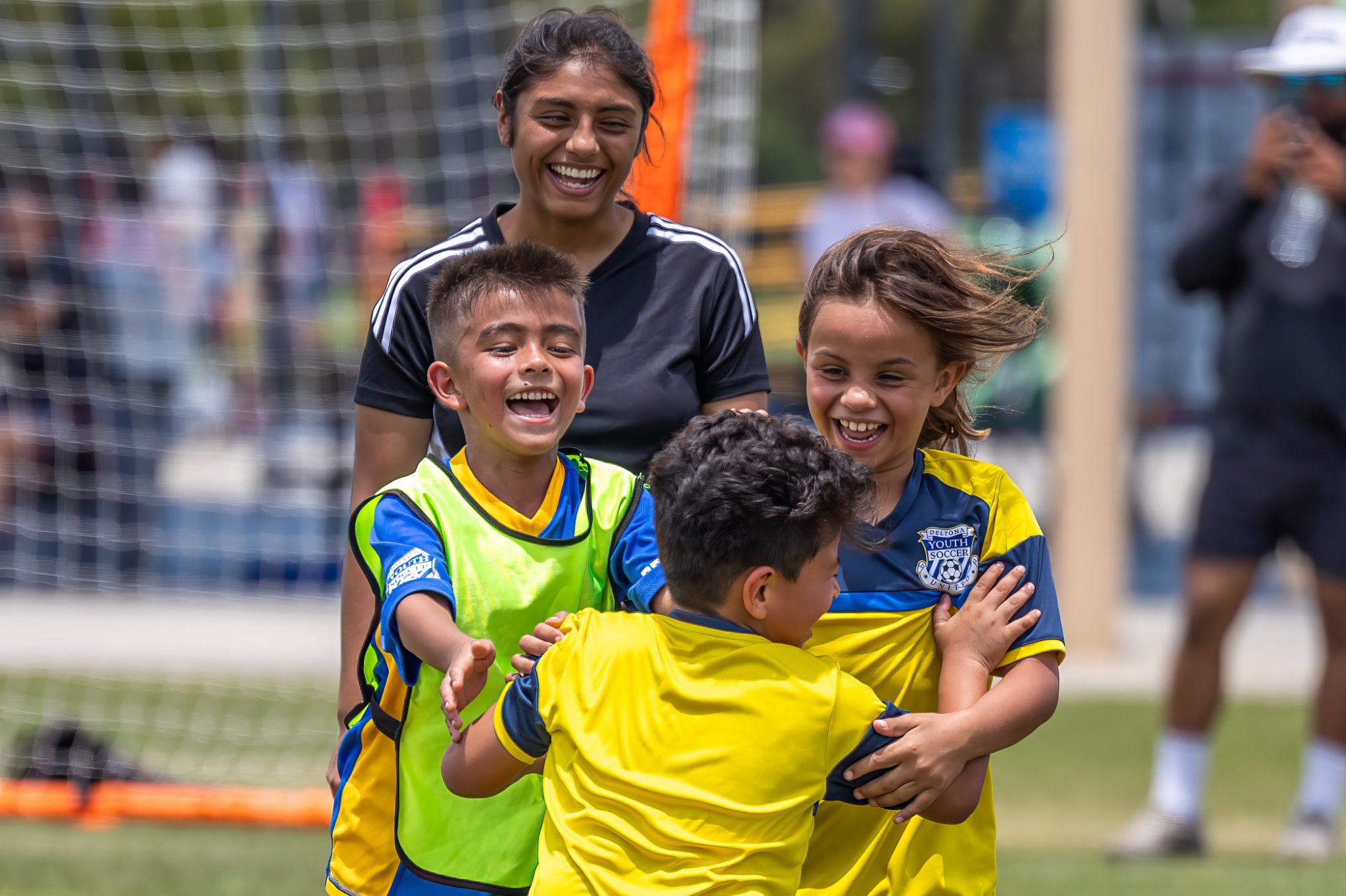 Young soccer players celebrate together with coach at Deltona Youth Soccer Club Recreation World Cup 2026 Deltona Florida