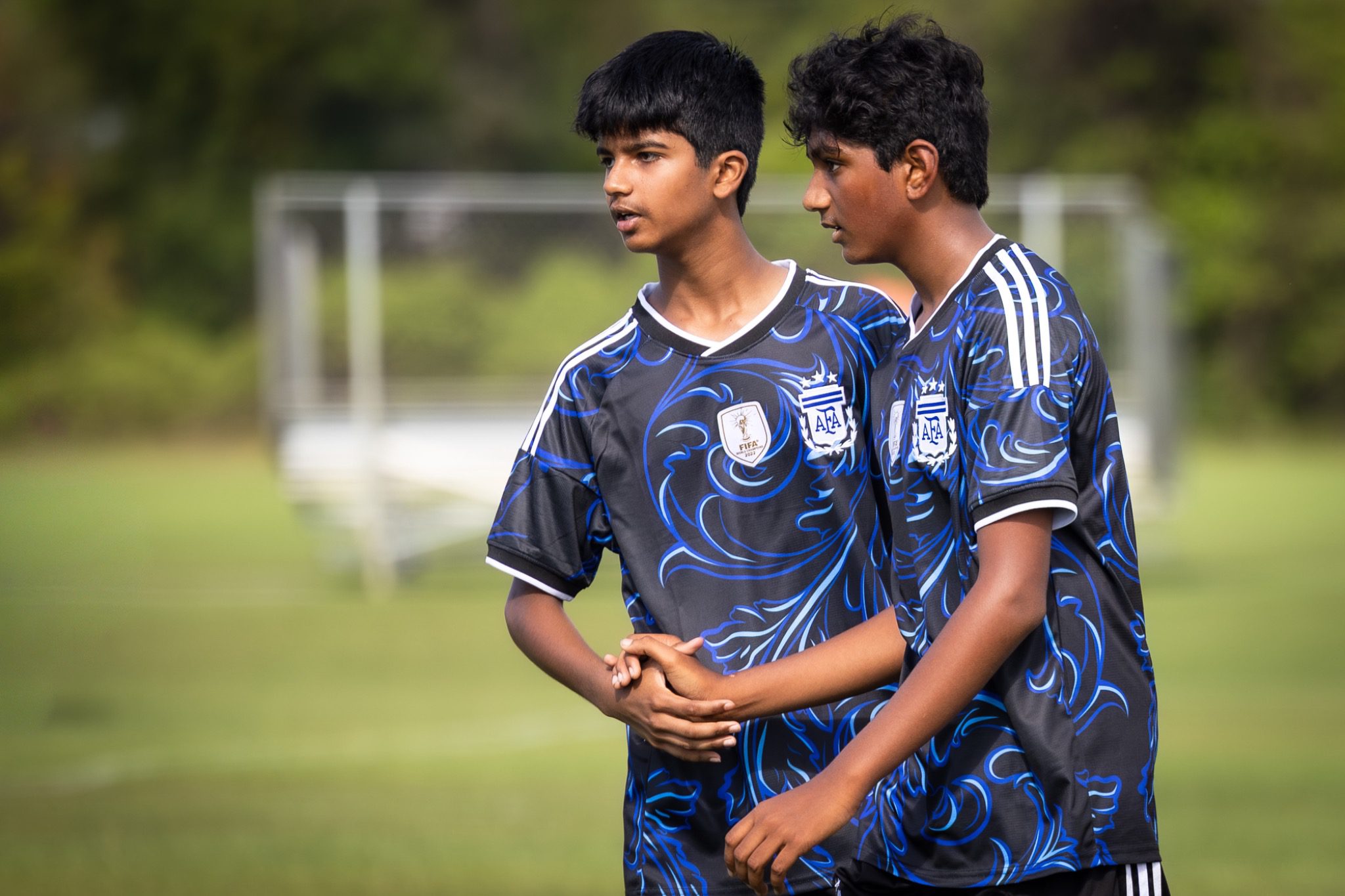 Two youth soccer players talk on the sideline at Deltona Youth Soccer Club Recreation World Cup 2026 Deltona Florida