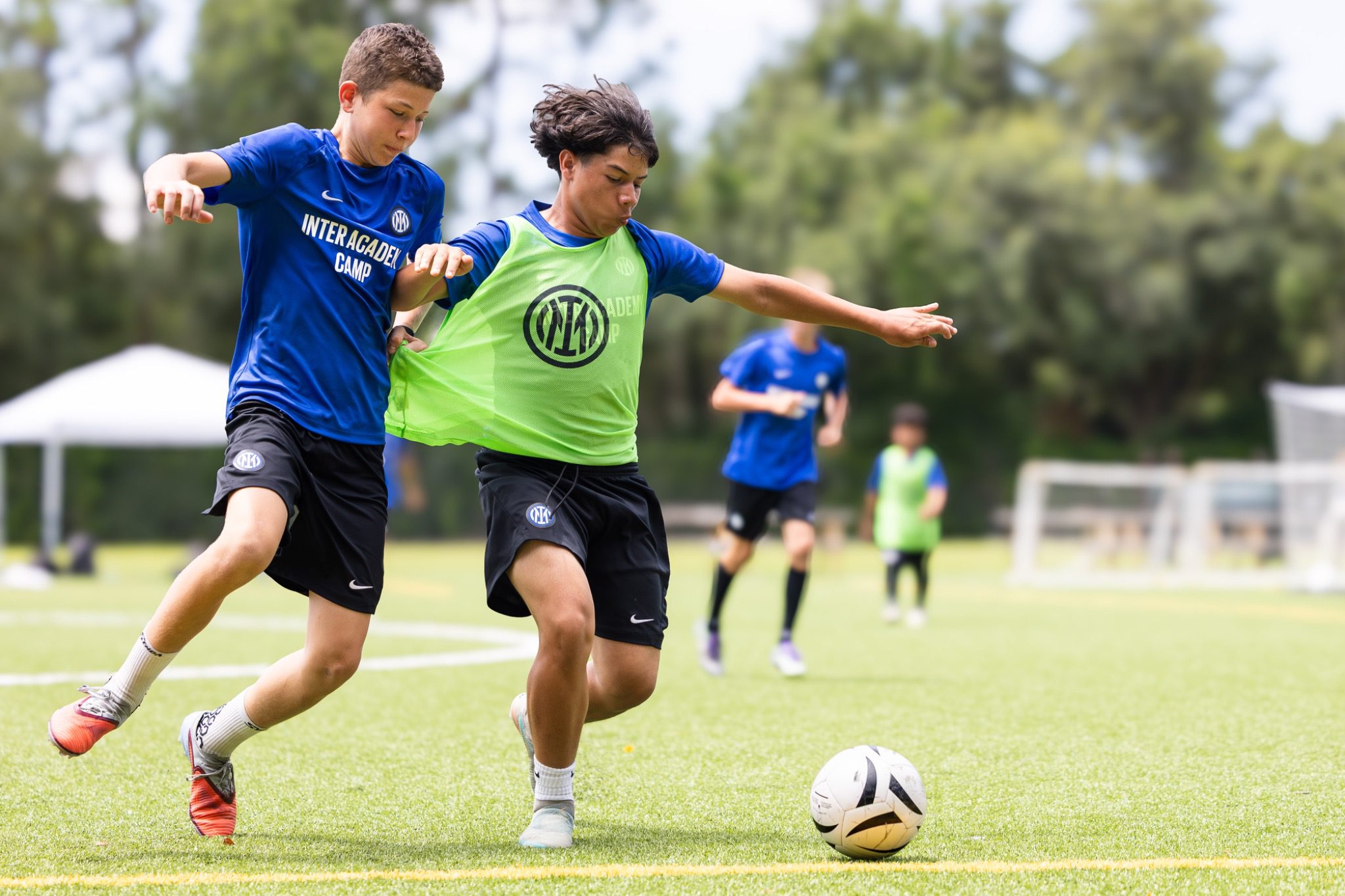 Youth soccer players battling for the ball at Inter Academy Milan camp in Deltona Florida June 2026